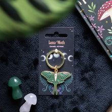 Load image into Gallery viewer, Luna Moth Keyring.  This ethereal keyring features an enameled, gold-tone luna moth charm on a matching backing card. 