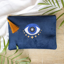 Load image into Gallery viewer, All Seeing Eye Velvet Make Up Bag.  This stunning makeup bag features the All Seeing Eye, a symbol and talisman which offers good luck and protection from misfortune. Designed using the tradtional blue hues of this good luck charm, along with a metallic gold tassel detail.