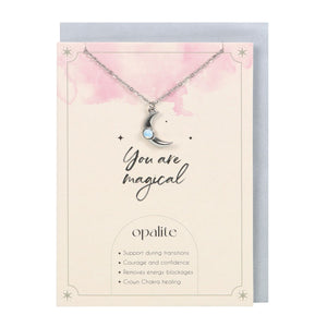 Opalite Crescent Moon Necklace & Card.  This inspiring 'You Are Magic' greeting card features a silver-tone crescent moon necklace accented by an opalite stone. Opalite is a manmade stone reminiscent of opal and moonstone, used to promote courage and remove energy blockages. 22cm chain with lobster clasp closure.