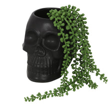 Load image into Gallery viewer, Black Skull Plant Pot.  This skull plant pot makes a great gift for those who aren&#39;t the most green-fingered and a little bit cynical of traditional gardening. Plant not included.  Measures 14.5cm x 13cm x 17.5cm.