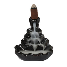 Load image into Gallery viewer, This ceramic backflow incense burner is specially designed to create smoke that cascades downwards, pouring dramatically down with a stunning rippling effect.  Once you have lit your incense cone, it will begin to smoke, the incense is heavier than air and it will fall dramatically in swirls and twists, through the hole and down over the item, to pool at the bottom. It is incredible to watch and very relaxing. 