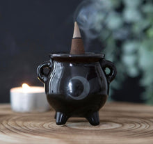 Load image into Gallery viewer, Moon Cauldron Ceramic Holder.  Whether used with incense sticks or cones, this ceramic cauldron incense holder makes a quirky gift for any witch.  A printed moon design finishes off this unique design.