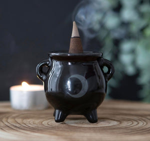 Moon Cauldron Ceramic Holder.  Whether used with incense sticks or cones, this ceramic cauldron incense holder makes a quirky gift for any witch.  A printed moon design finishes off this unique design.