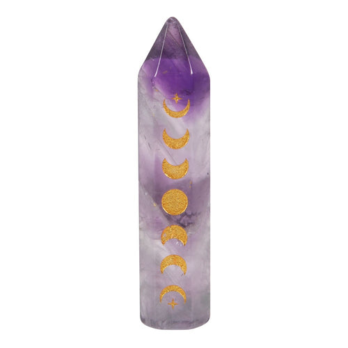 Amethyst Moon Phase Crystal Point .  This beautiful rose quartz crystal point is perfect in size for travel altars, desk decor or taking on the go for extra protection. Features a gold-tone moon phase engraving and comes with a matching drawstring bag for storage and s
